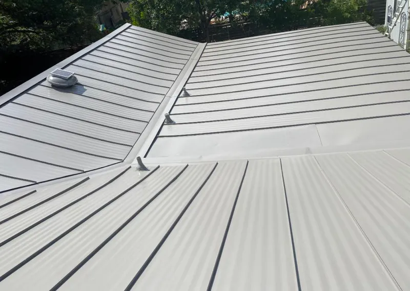 Solar attic fan installed on a metal roof for Roof Ventilation in Aledo